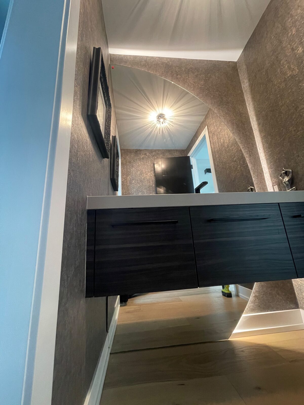 Custom mirror over a floating vanity