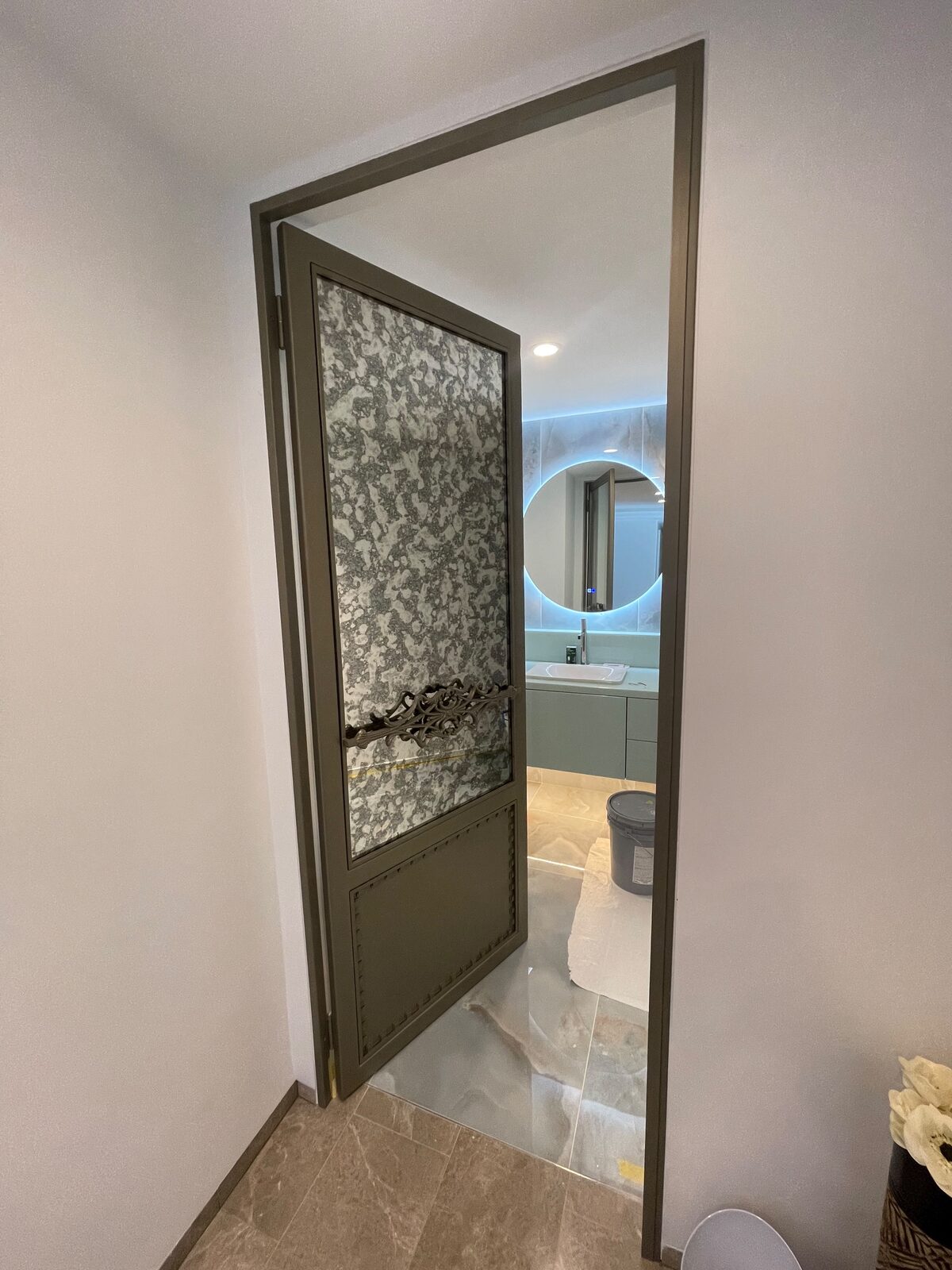 Custom mirror and glass door in a bathroom