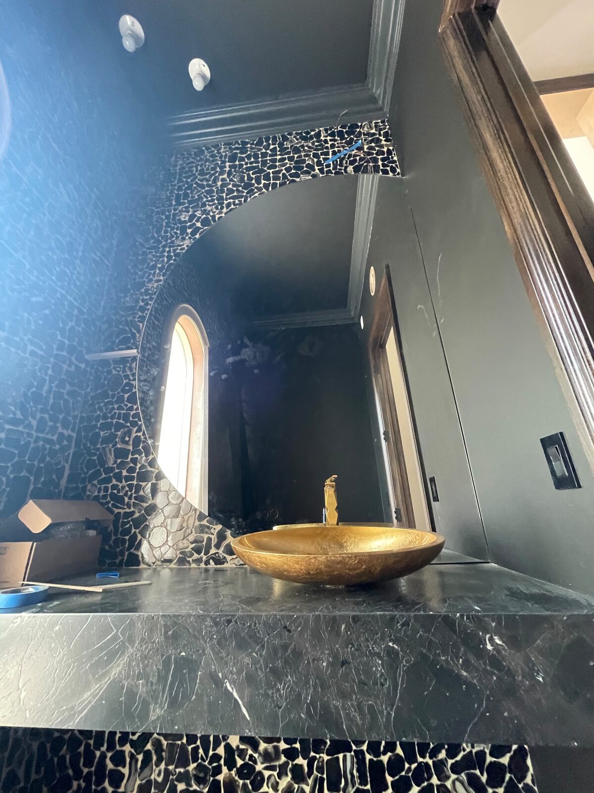 Custom round mirror over a vanity