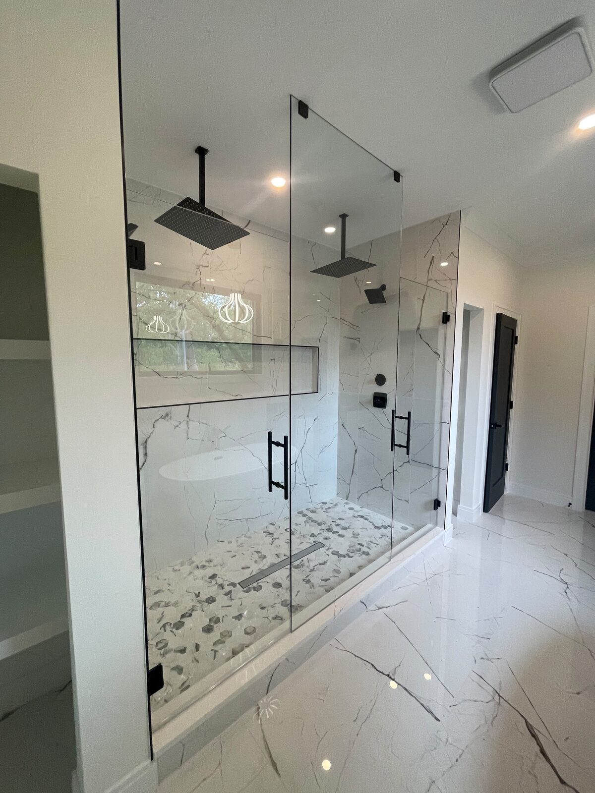 Frameless double glass shower with black hardware