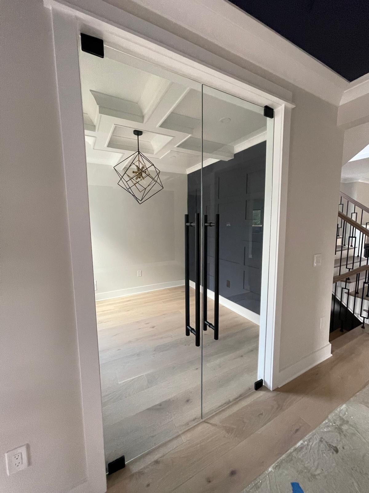 Frameless glass double-door office entry