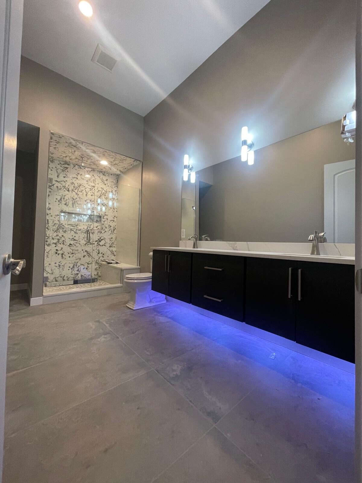 Frosted glass shower with LED double vanity mirror