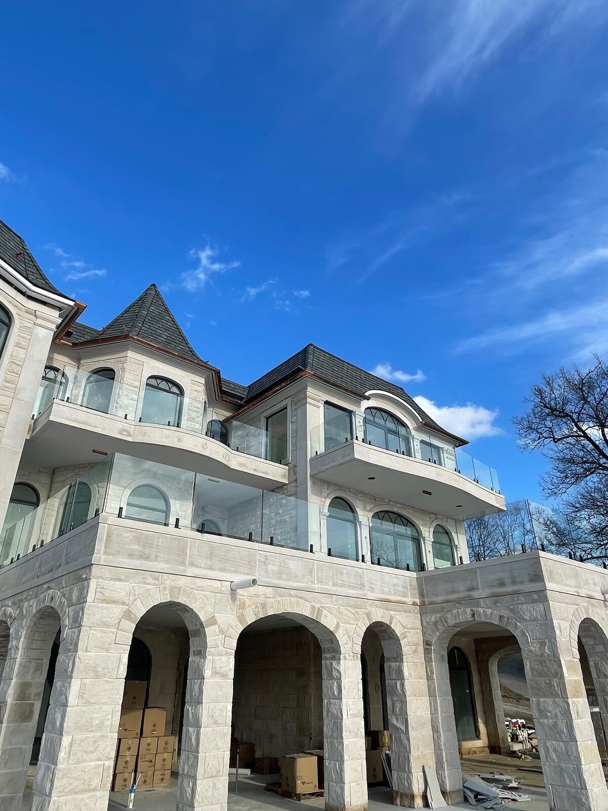 Glass balcony railing on a stone estate