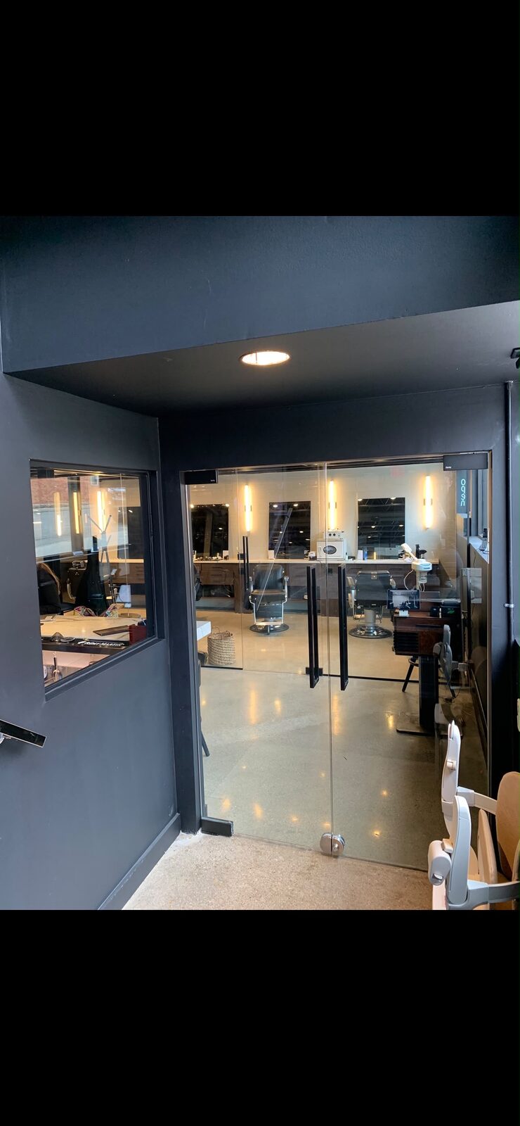 Glass storefront door for a salon